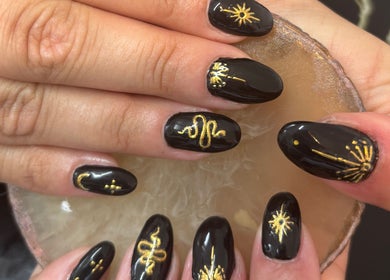 Elegant black nails with gold design at Chantel Marie Nails & Beauty in Micklefield, England, GB.