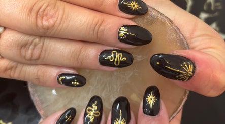 Elegant black nails with gold design at Chantel Marie Nails & Beauty in Micklefield, England, GB.