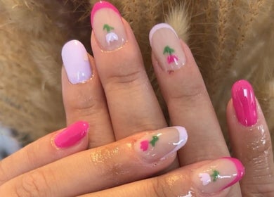 Elegant floral nail art by Chantel Marie Nails & Beauty in Micklefield, England, GB, showcasing vibrant chic designs.