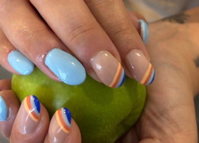 Colorful nail art at Chantel Marie Nails & Beauty, Micklefield, England, GB. Blue and striped designs showcased.
