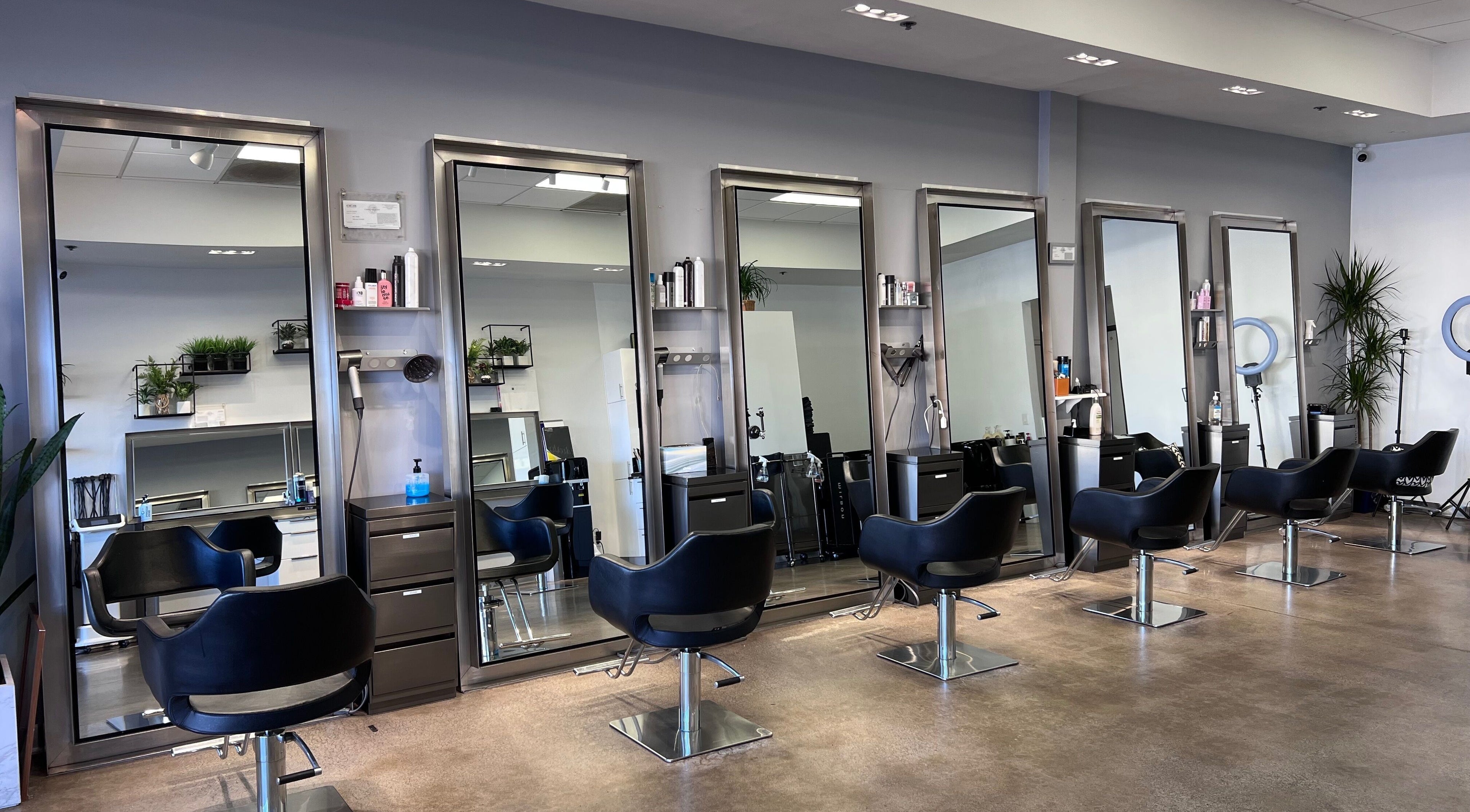 Elegant salon interior at Minimore极简造型, Rowland Heights, California, US, showcasing modern styling stations.