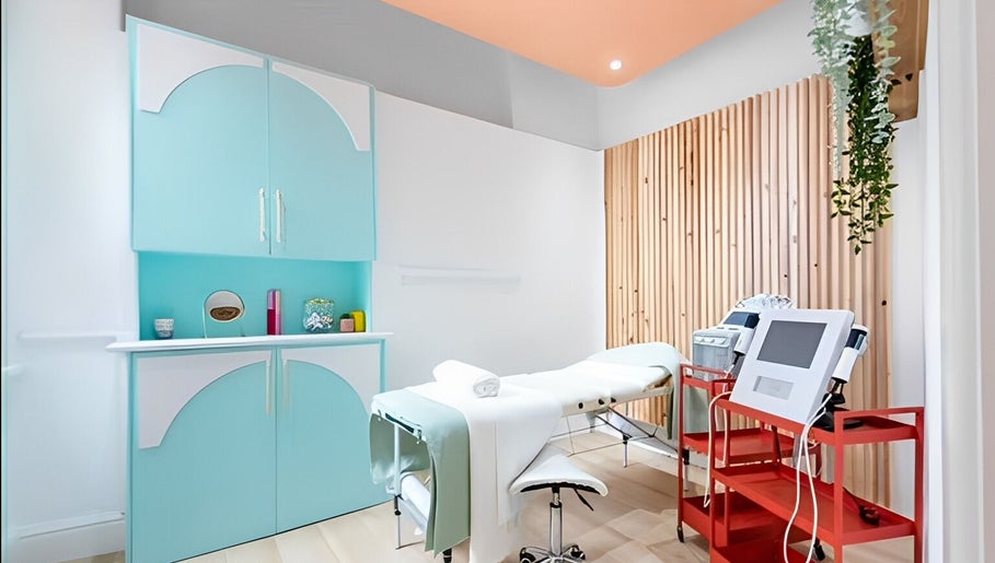 Bright spa treatment room at The Glow Up Social, Manchester, England, GB with modern decor and equipment.