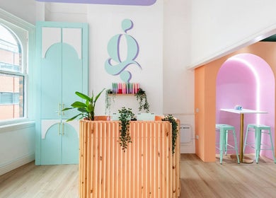 The Glow Up Social venue in Manchester, England, GB, showcasing colorful, modern interior design with pastel hues.