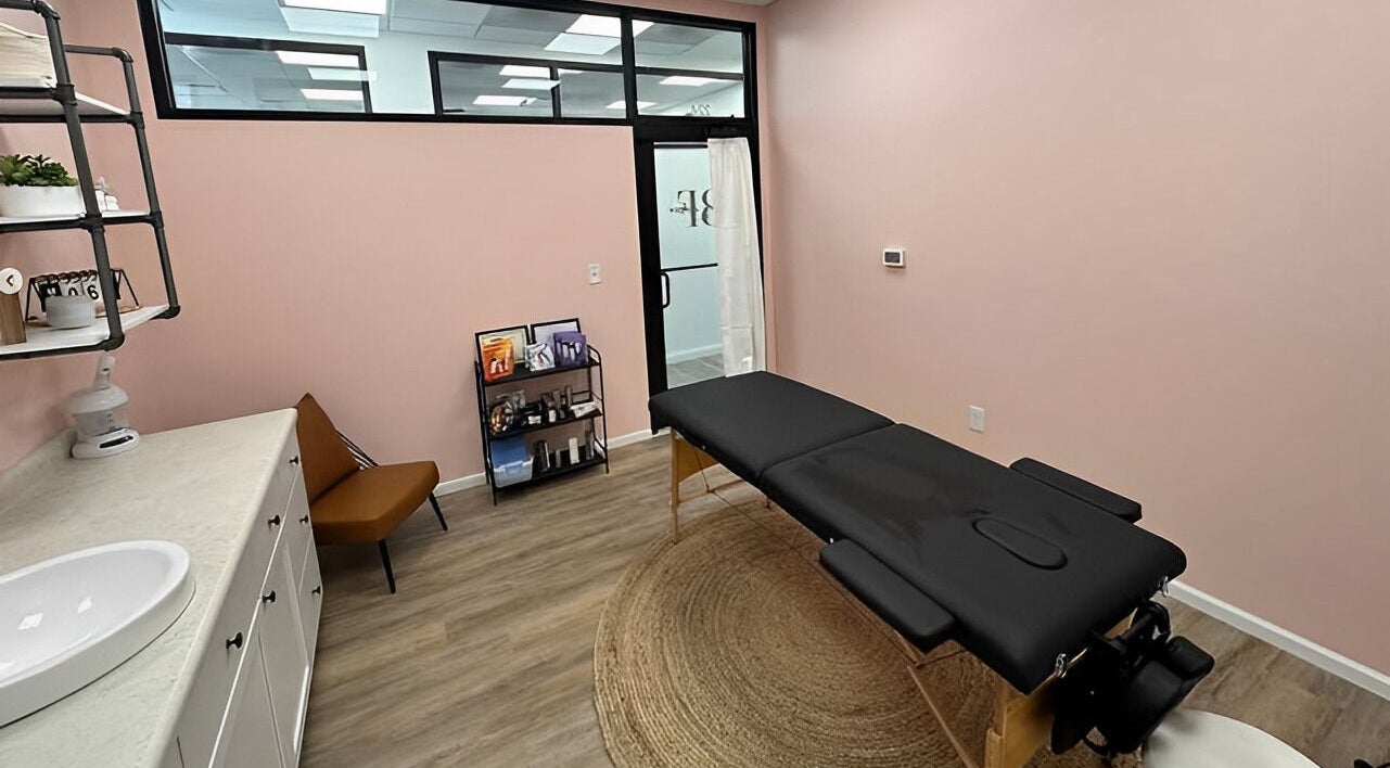 Peaceful treatment room at Beauty & Face Esthetics in Moline, Illinois, US with massage table and calming decor.