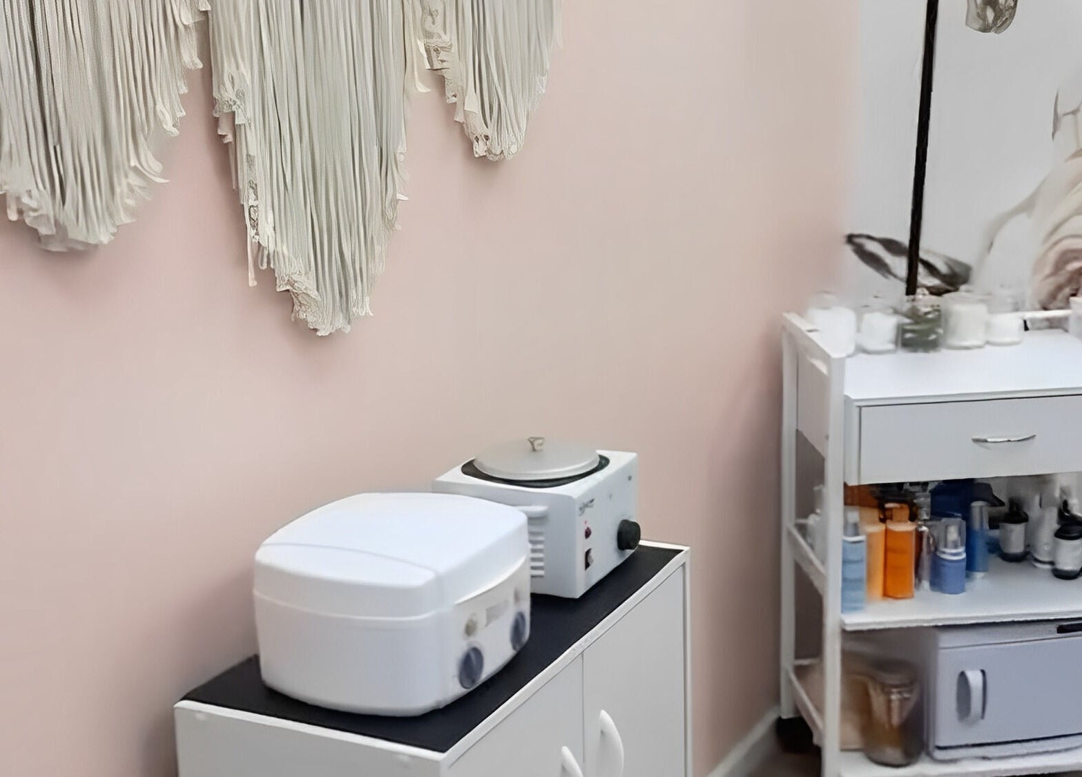 Relaxing beauty treatment room at Beauty & Face Esthetics in Moline, Illinois, US with elegant decor.