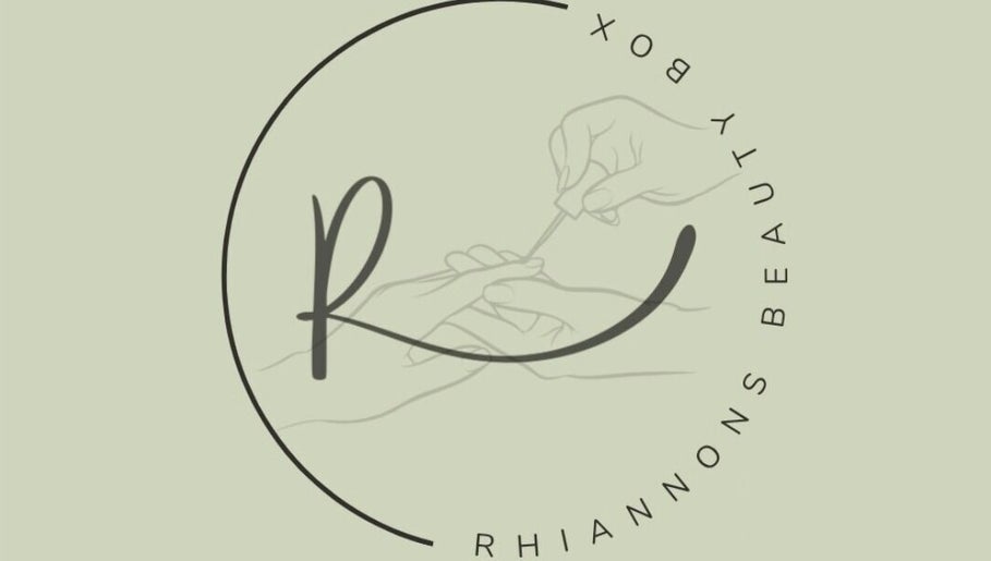 Artistic logo of Rhiannon's Beauty Box in Long Melford, England, featuring elegant nail care.