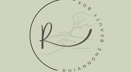 Artistic logo of Rhiannon's Beauty Box in Long Melford, England, featuring elegant nail care.