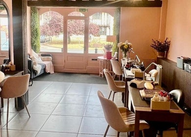 Elegant interior of Rhiannon's Beauty Box in Long Melford, England, GB with stylish seating and decor.