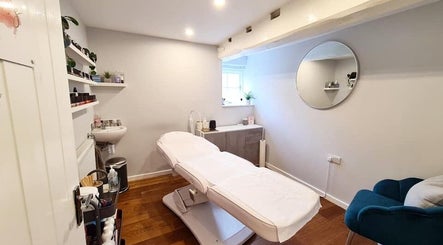 Calming interior of Rhiannon's Beauty Box, Long Melford, England, GB with a modern treatment bed.