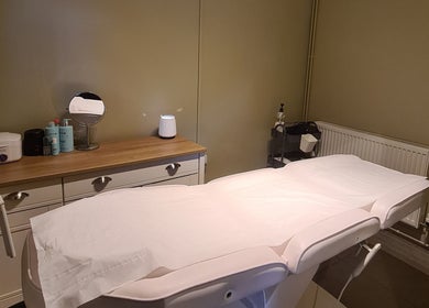 Cozy treatment room at Rhiannon's Beauty Box, Long Melford, England, GB. Elegant setup with a massage table.
