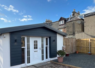 Modern exterior of Hidden Lane Hair in Winchburgh, Scotland, GB, showcasing stylish design and inviting entrance.