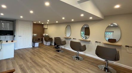 Interior of Hidden Lane Hair, Winchburgh, Scotland, GB with stylish chairs and mirrors.