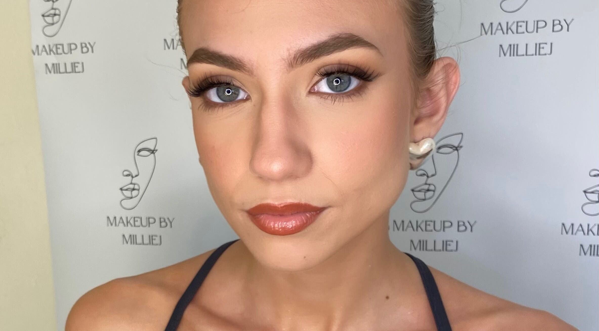 Stunning makeup look by Makeup by Millie J, Bungalow, Queensland, AU showcasing flawless skin and bold eyes.