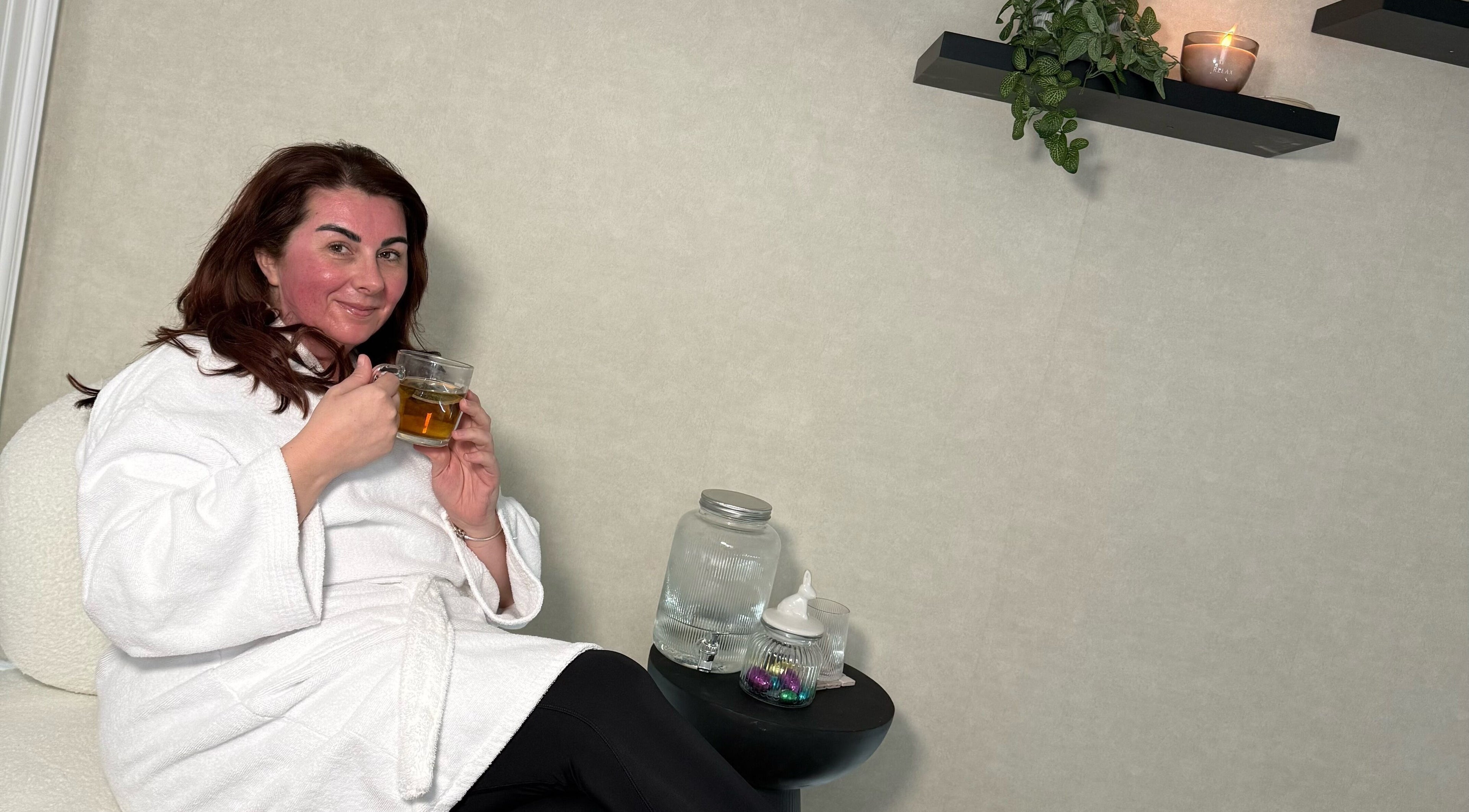 Woman enjoying tea in a cozy room at Aesthetic Invasion, Liverpool, England, GB.