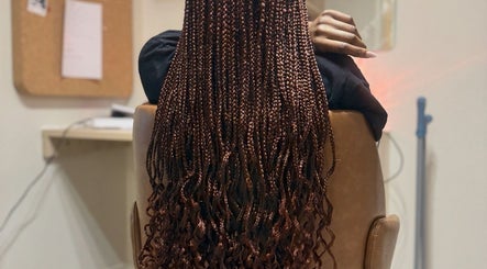 Intricate braids styled at Faitcy Beauty Salon in Liverpool, England, GB offer a stunning look for clients.