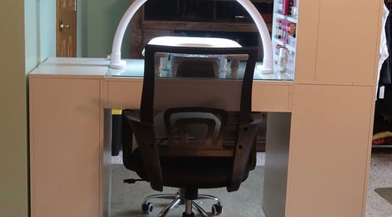 Modern manicure station at KD Designs, Lawrenceburg, Indiana, US, featuring sleek design and ample storage.