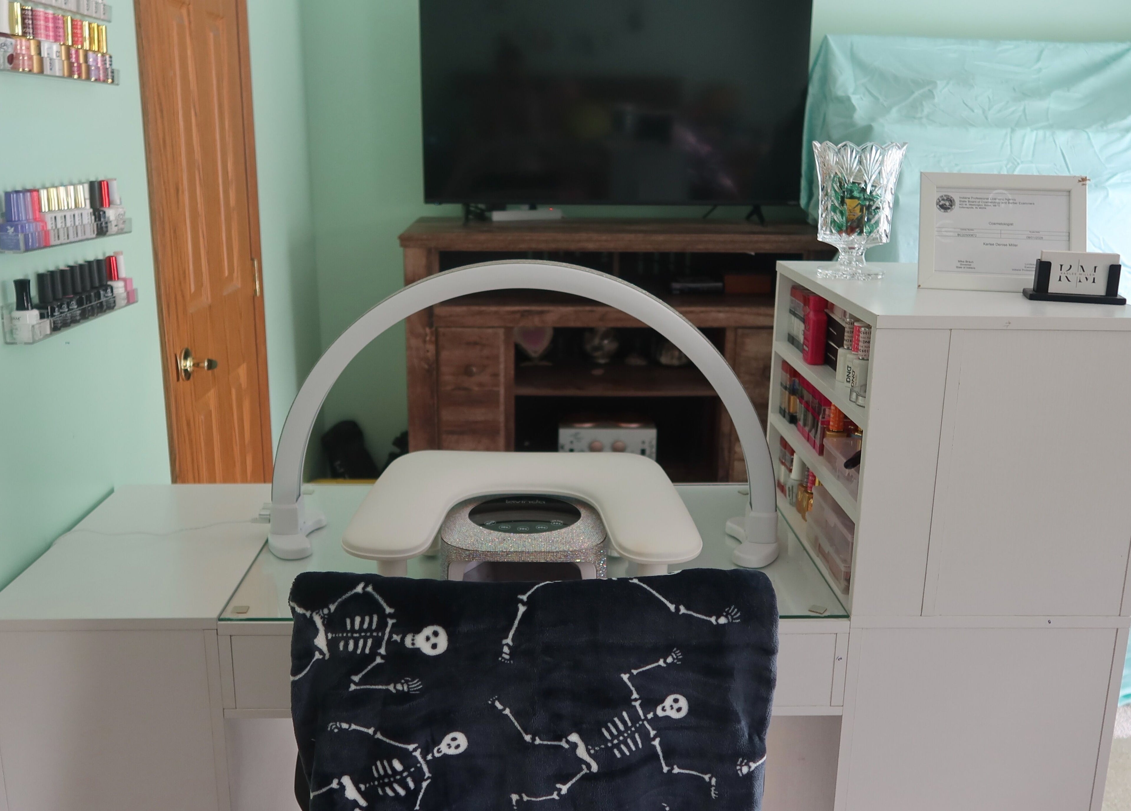 Elegant nail station at KD Designs in Lawrenceburg, Indiana, US with organized polish display and modern decor.