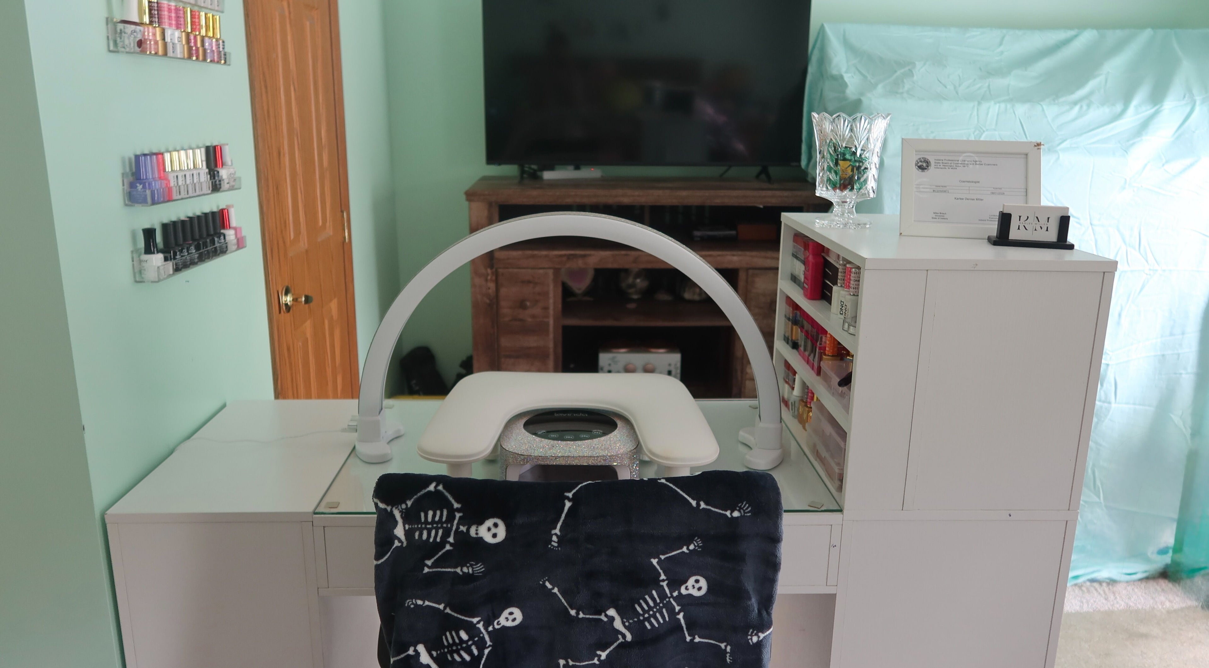 Elegant nail station at KD Designs in Lawrenceburg, Indiana, US with organized polish display and modern decor.