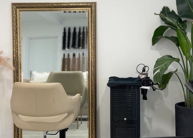 Elegant salon setup with a mirror at Lily Solomon hair in Melbourne, Victoria, AU, showcasing a modern vibe.