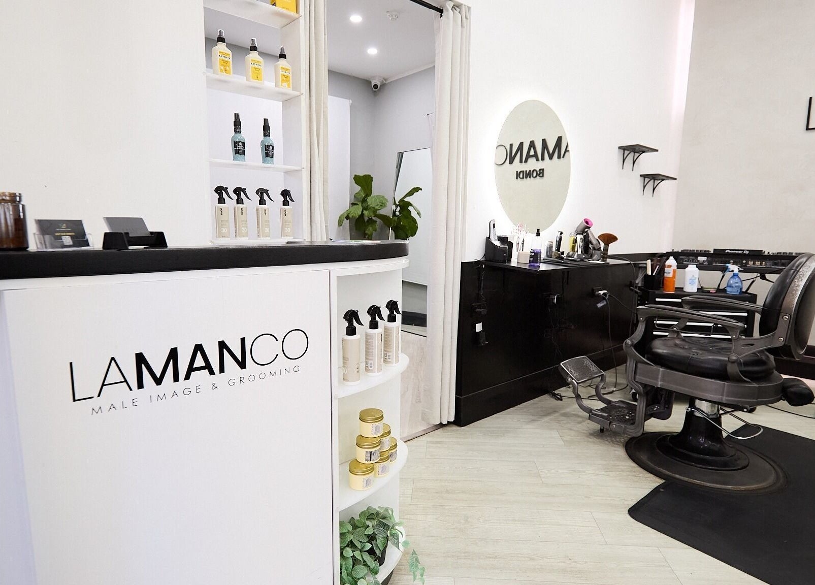 Inside Lamanco Barbershop at Bondi Beach, New South Wales, showcasing sleek design and grooming products.