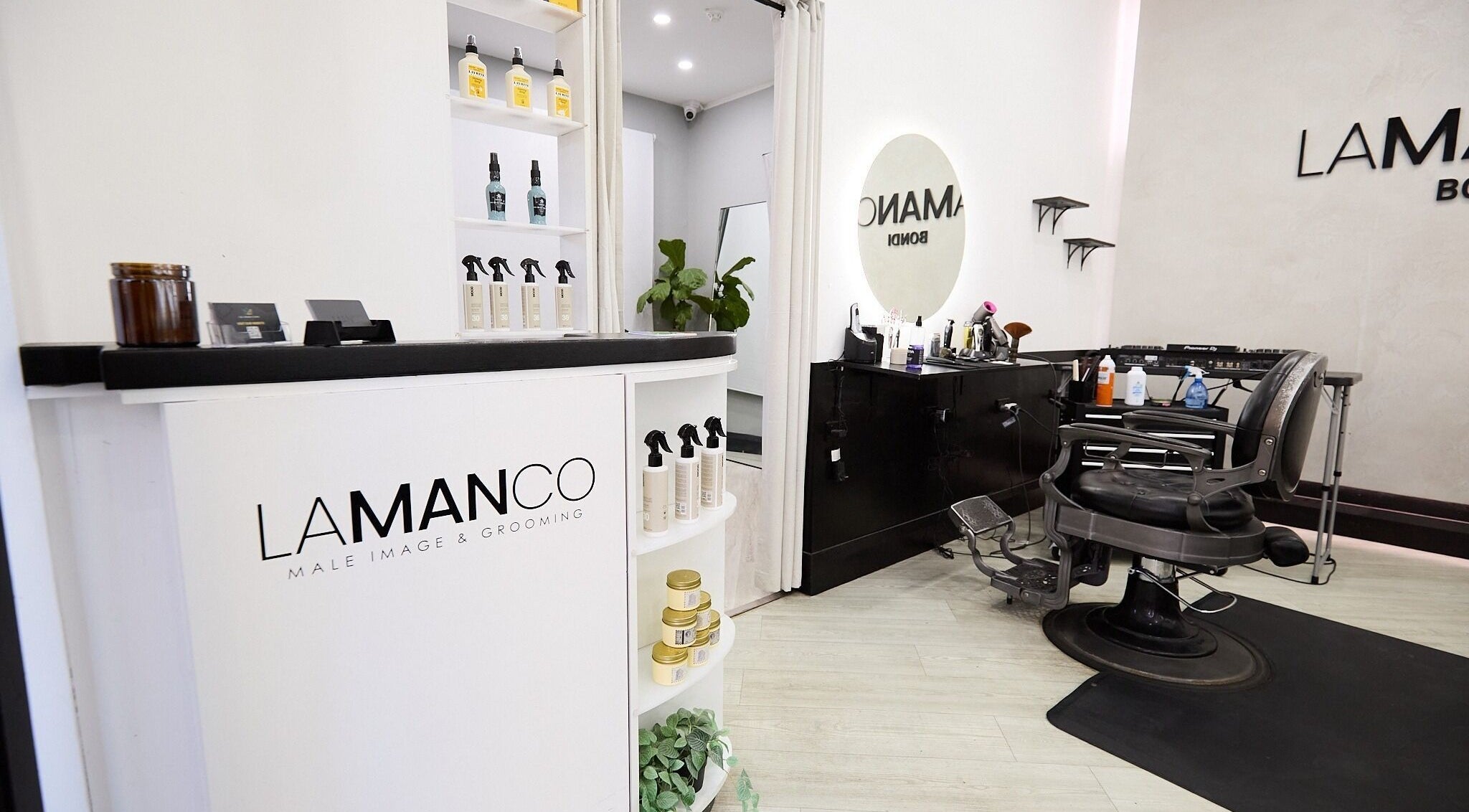 Inside Lamanco Barbershop at Bondi Beach, New South Wales, showcasing sleek design and grooming products.