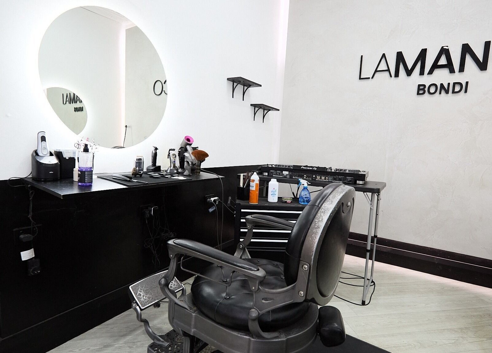 Modern barber chair and tools at Lamanco Barbershop in Bondi Beach, New South Wales, AU.