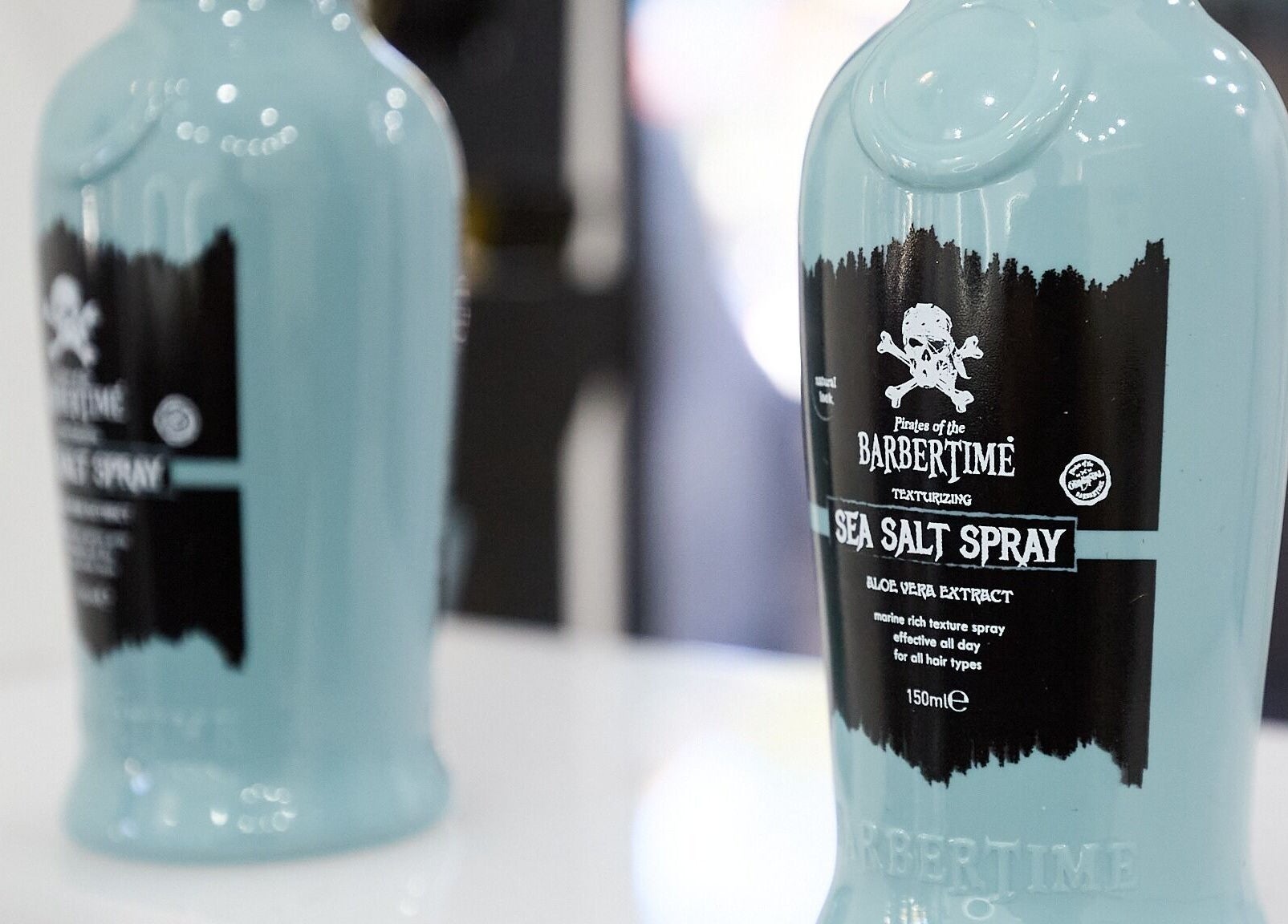 Close-up of sea salt spray bottles at Lamanco Barbershop, Bondi Beach, New South Wales, AU.