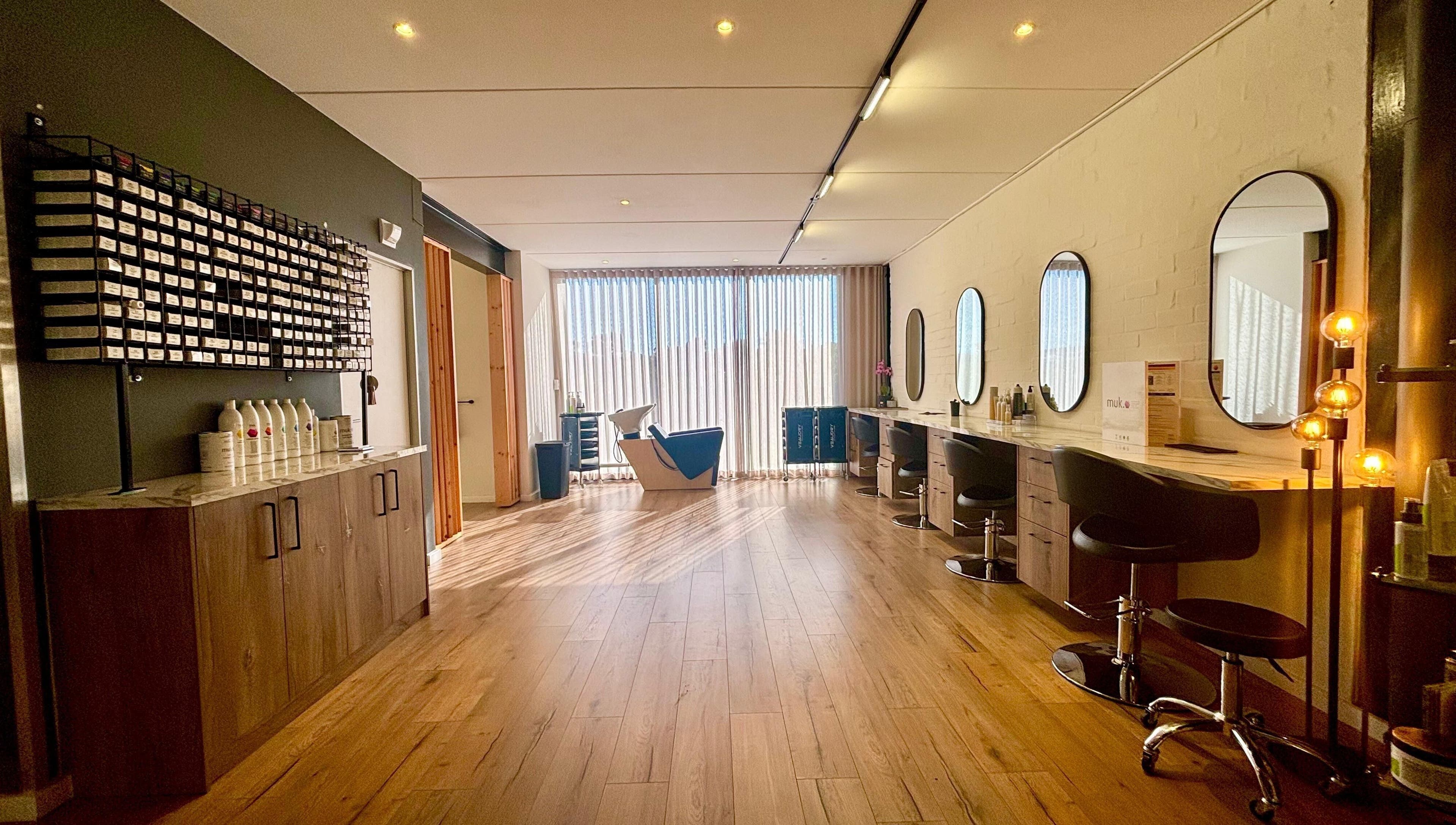 Modern salon interior at Veaudry International CAPE TOWN, Cape Town, Western Cape, ZA with sleek styling stations.