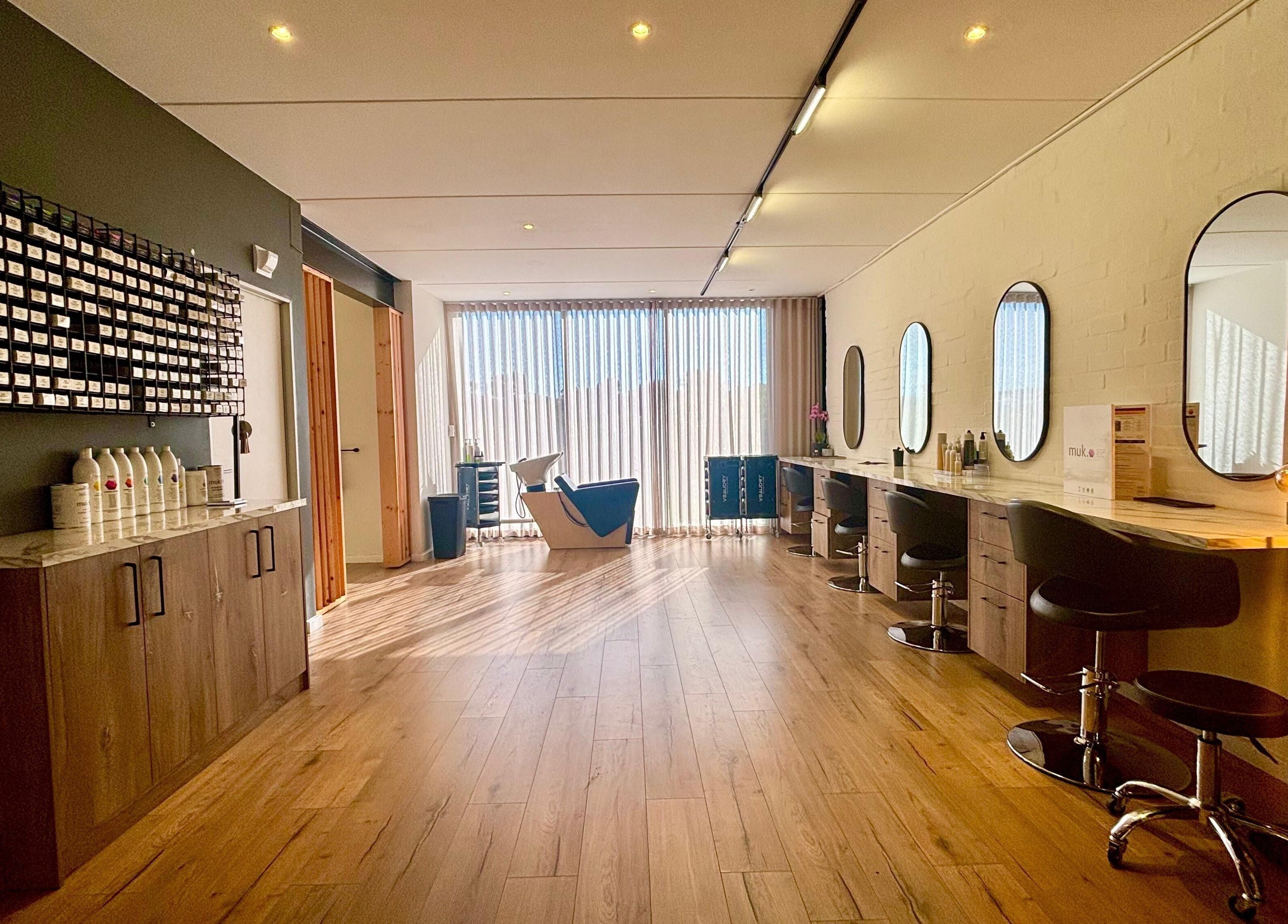 Modern salon interior at Veaudry International CAPE TOWN, Cape Town, Western Cape, ZA with sleek styling stations.