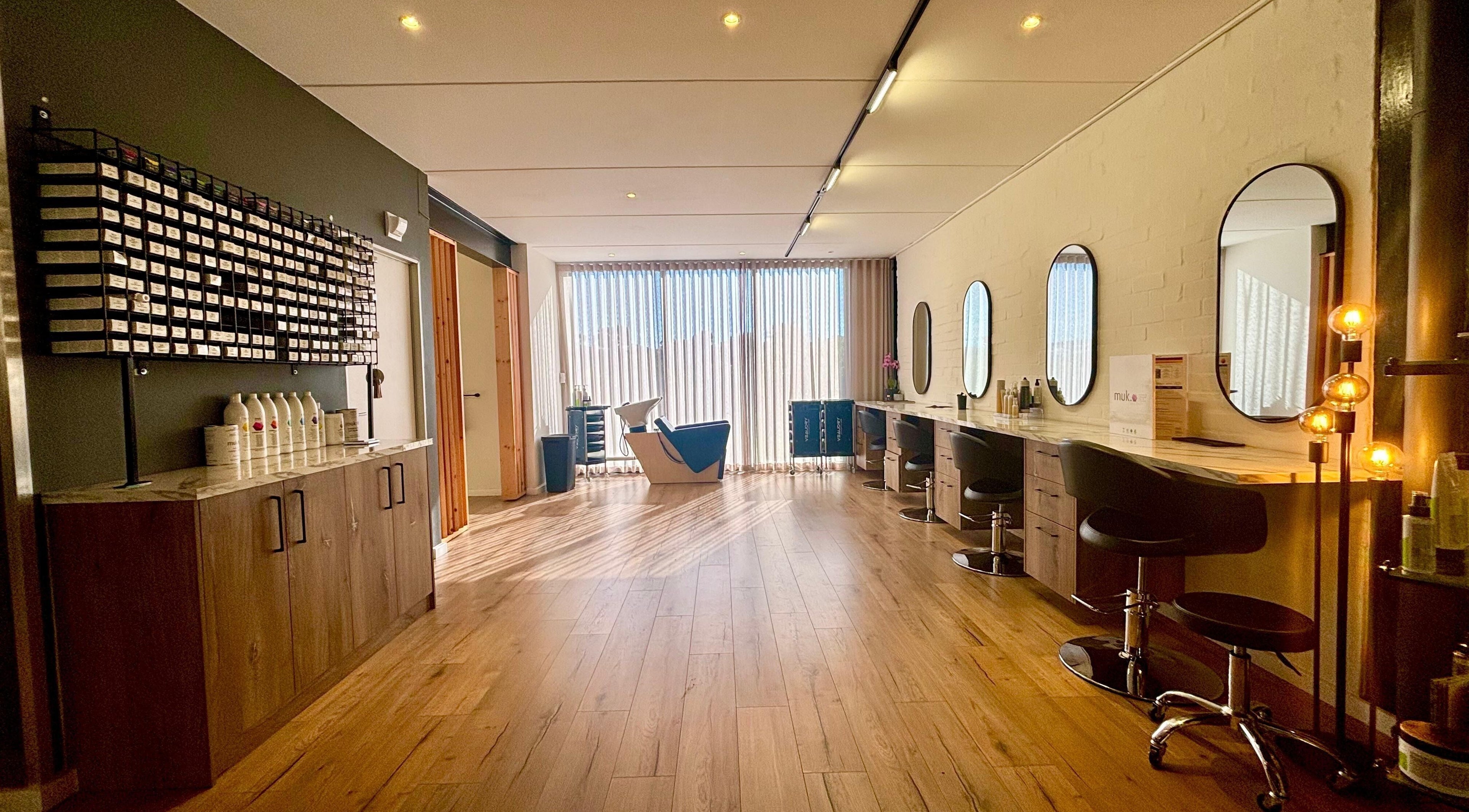 Modern salon interior at Veaudry International CAPE TOWN, Cape Town, Western Cape, ZA with sleek styling stations.
