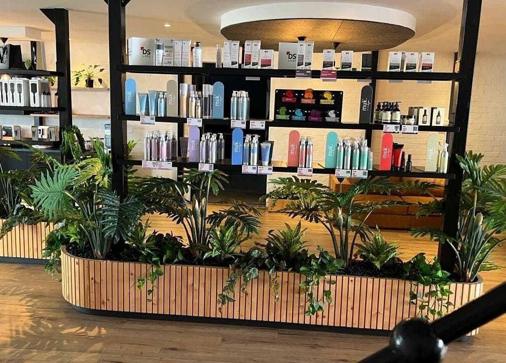 Stylish product display at Veaudry International CAPE TOWN, Cape Town, Western Cape, ZA, with lush greenery.