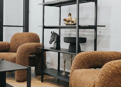 Stylish sitting area at Aesthetics By Wendy in Brunswick East, Victoria, AU featuring plush brown chairs.