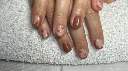 Chic brown nail art with hearts at Touch Of Glam by Tiff, Dubbo, New South Wales, AU.