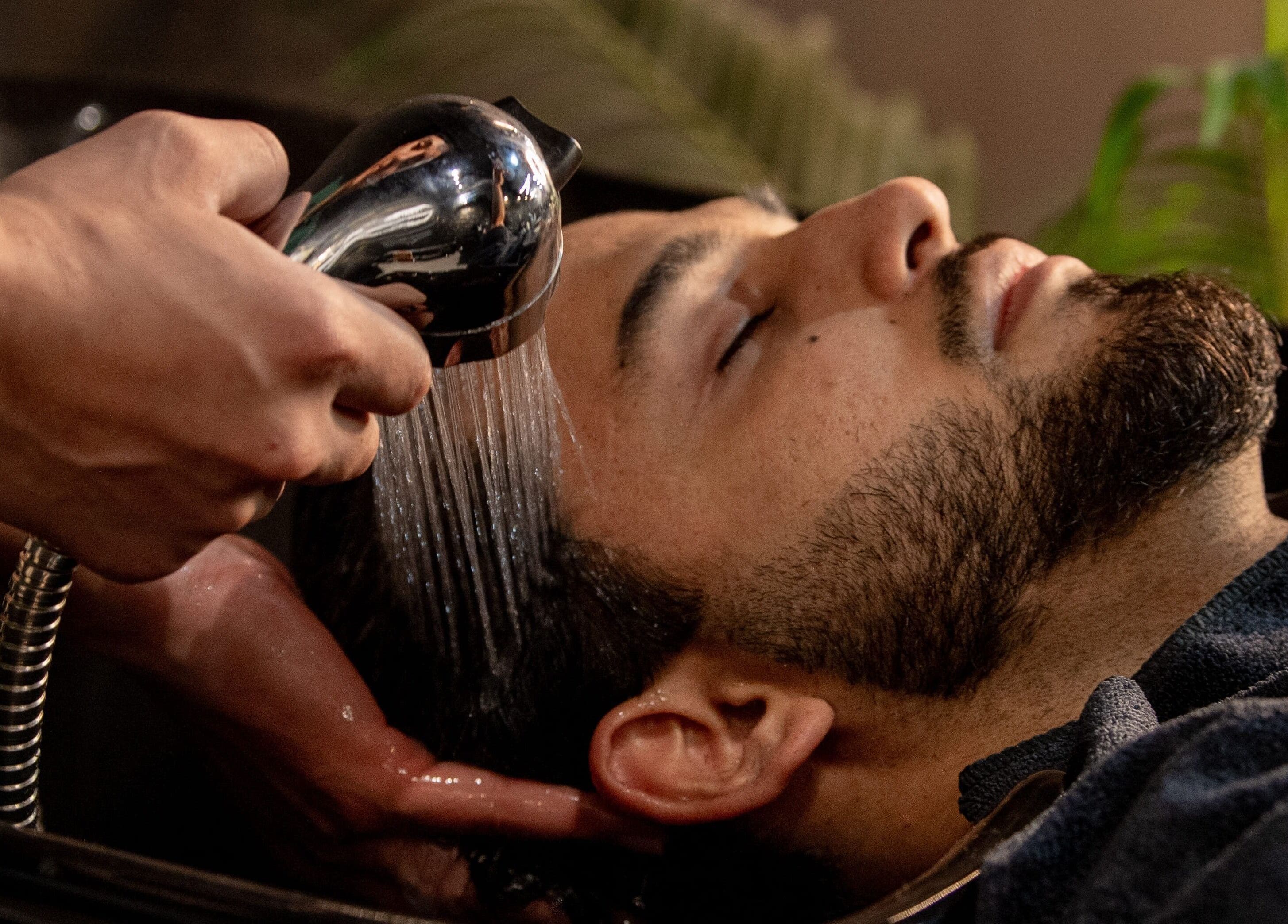 Hair wash service at The Rare Barber Shop, Auckland, Auckland, NZ, showcasing relaxation and care.