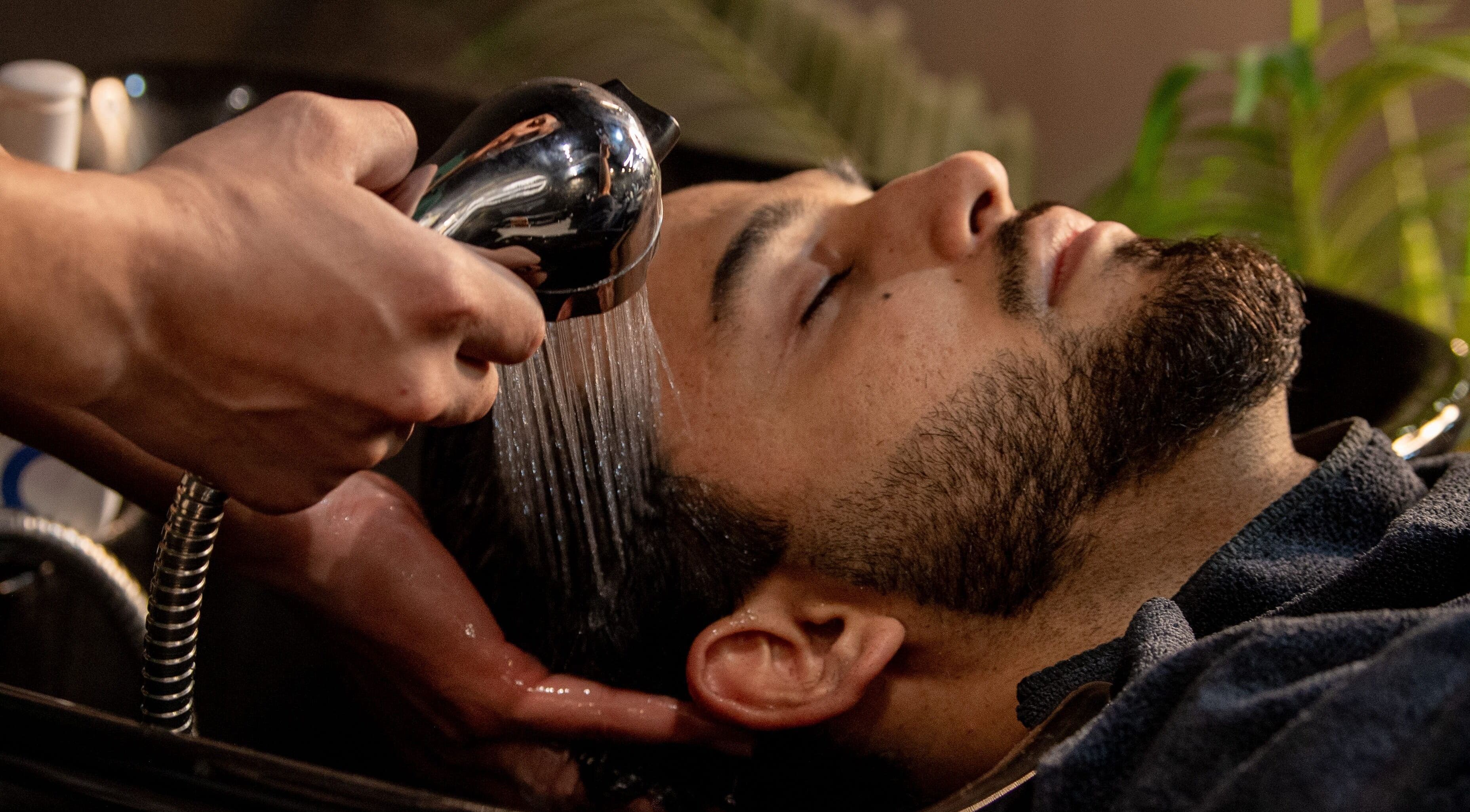 Hair wash service at The Rare Barber Shop, Auckland, Auckland, NZ, showcasing relaxation and care.
