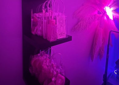 Flutter + Frame Co. venue in Highland, Indiana, features vibrant shelves with wellness products and neon lighting.