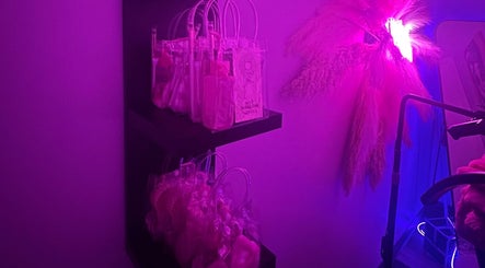 Flutter + Frame Co. venue in Highland, Indiana, features vibrant shelves with wellness products and neon lighting.
