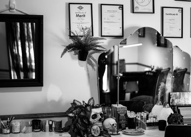 Elegant vanity at Redemption Nails & Beauty in Narangba, Queensland, AU showcasing certificates and decor.