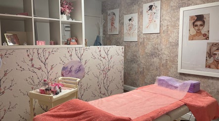 Chic treatment room at Sisi Beauty in Jarrow, England, GB, with floral decor and soothing ambiance.