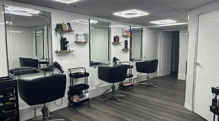 Modern salon setup at Cerys Dickson Hair at KM Hair Lounge in East Kilbride, Scotland, GB with sleek chairs and mirrors.