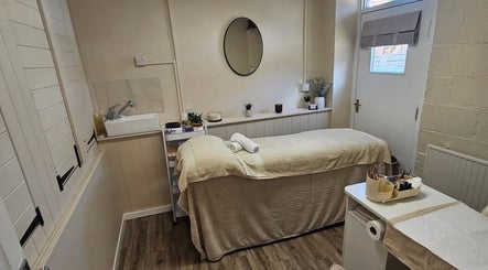 Cozy treatment room at Grove House Beauty, Misterton, England, GB, featuring a comfortable massage bed.