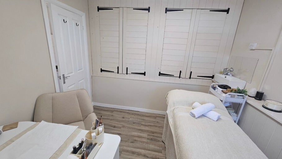 Cozy treatment room at Grove House Beauty, Misterton, England, GB with a massage bed and soothing decor.