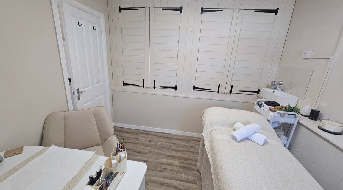 Cozy treatment room at Grove House Beauty, Misterton, England, GB with a massage bed and soothing decor.