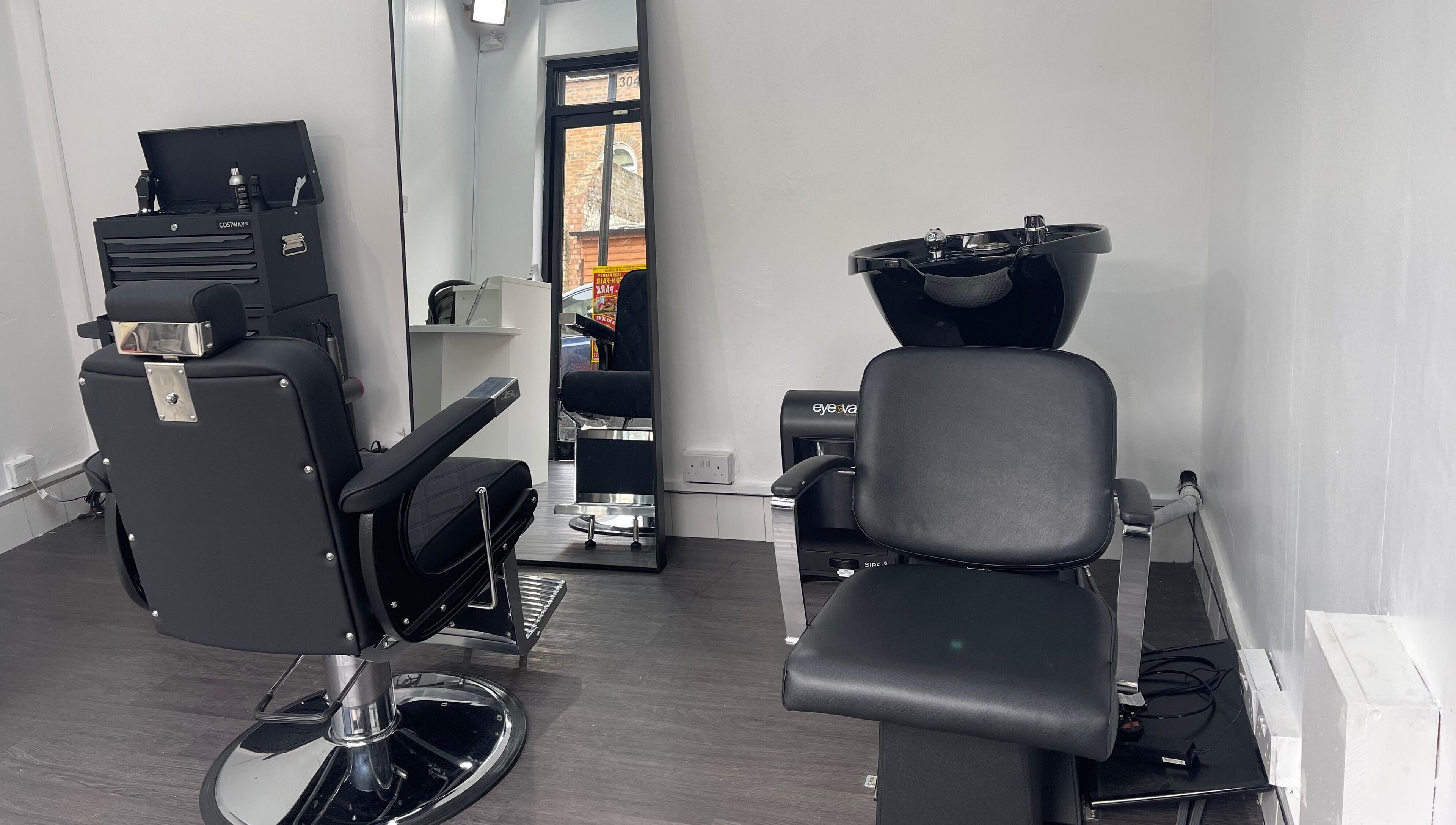 Modern styling chairs at Alexandre Cuts, London, England, GB offering sleek hair services.