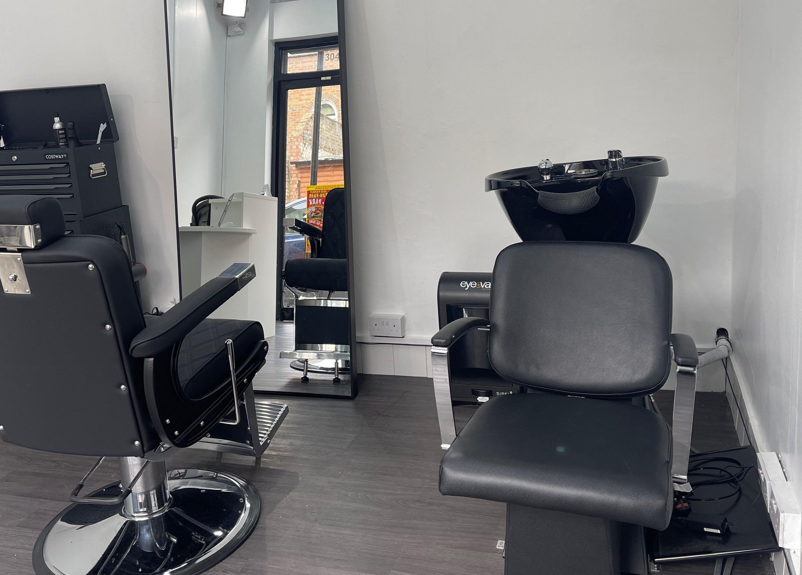 Modern styling chairs at Alexandre Cuts, London, England, GB offering sleek hair services.