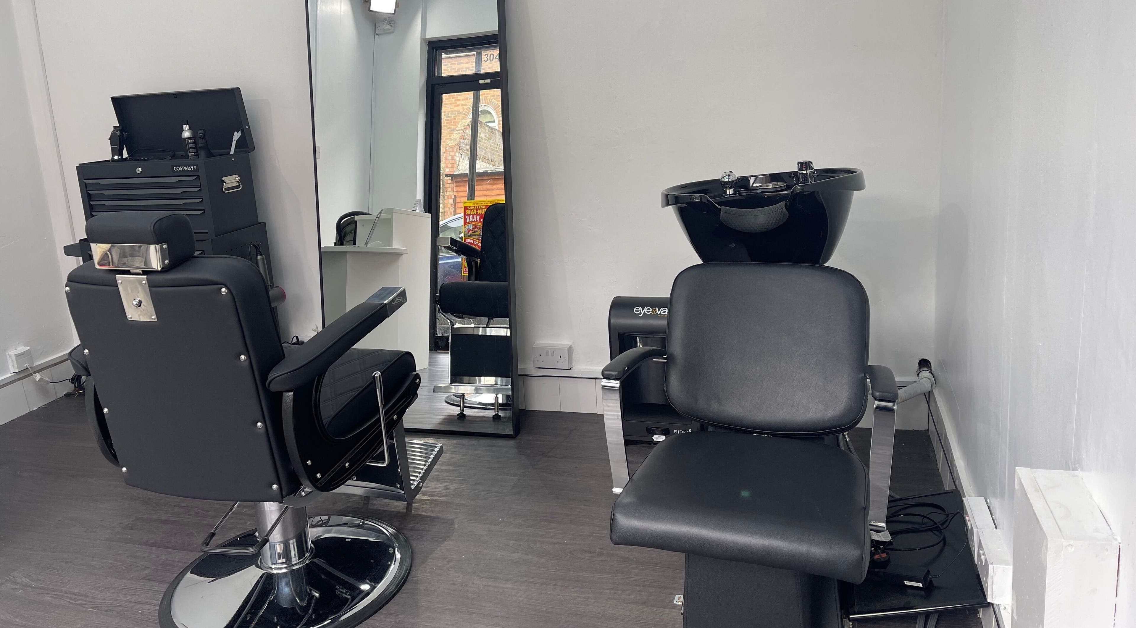 Modern styling chairs at Alexandre Cuts, London, England, GB offering sleek hair services.