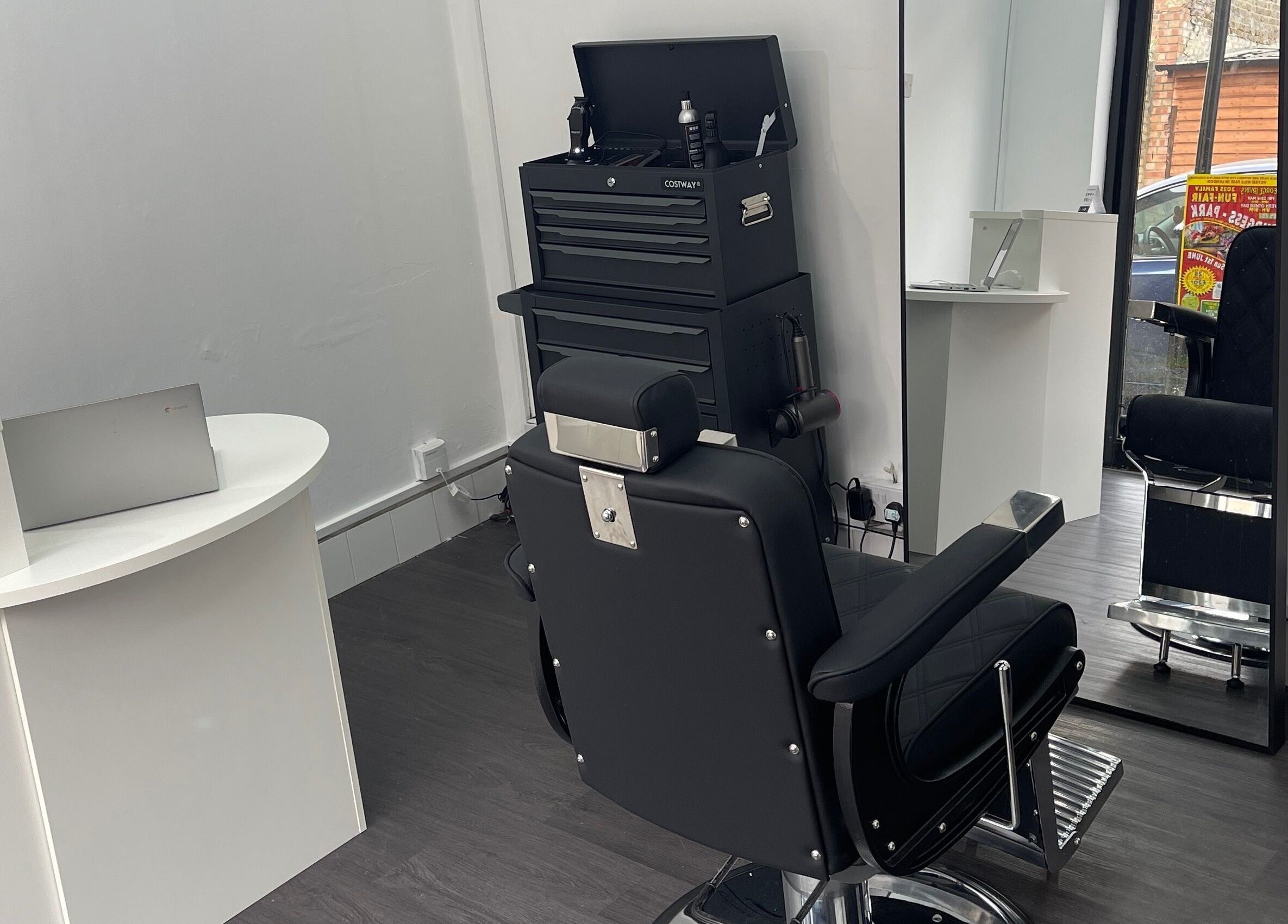 Sleek barber chair and tools at Alexandre Cuts, London, England, GB.