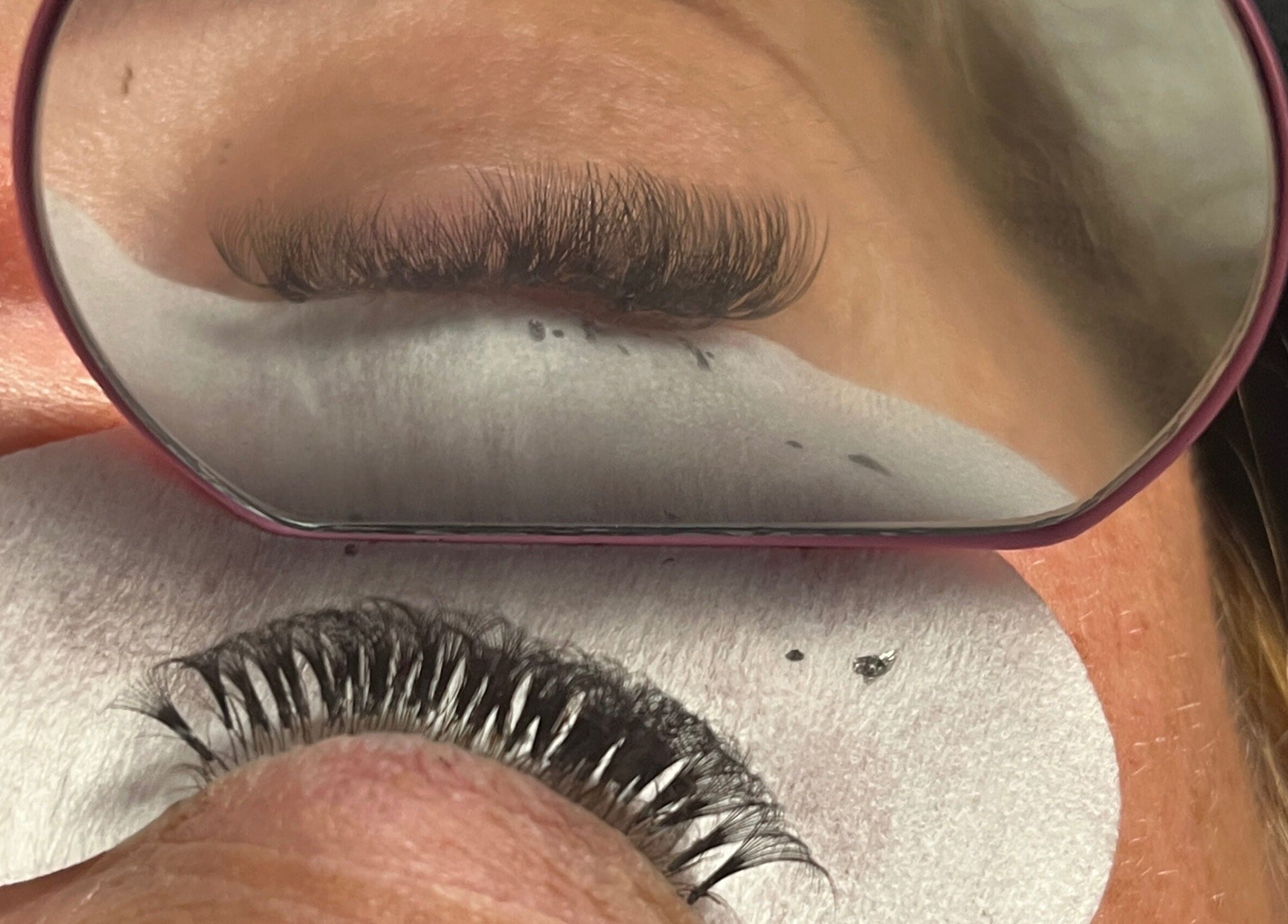 Close-up of lash extensions at lashedbykkenzie, Dundee, Scotland, GB. Enhanced reflections highlighting detailed work.