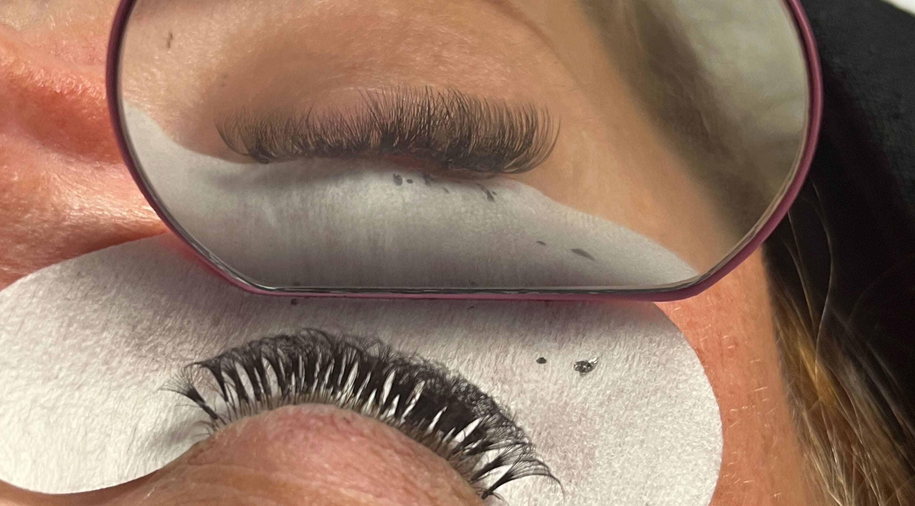 Close-up of lash extensions at lashedbykkenzie, Dundee, Scotland, GB. Enhanced reflections highlighting detailed work.