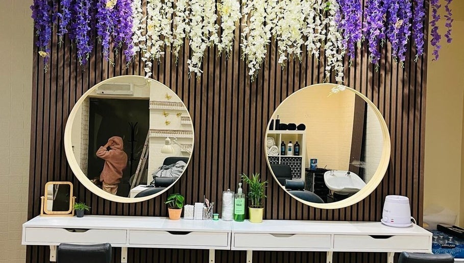 Stylish vanity with round mirrors at Shriji Beauty Touch, Huddersfield, England, GB.